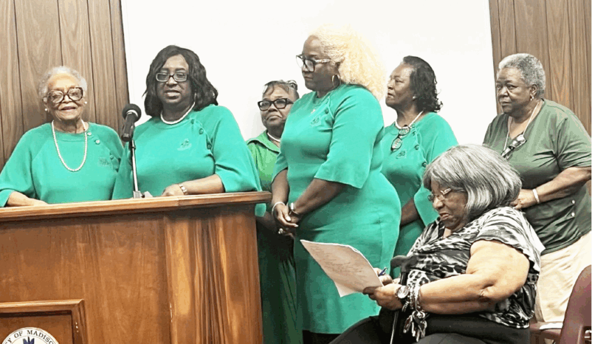 Members of the Nu Omega Omega chapter of the Alpha Kappa Alpha Sorority ask the commissioners to name the new Public Works Facility in honor of former City Manager Jerome Wyche. He was instrumental in securing a much-needed new facility for city employees. [Mickey Starling/Greene Publishing, Inc.]